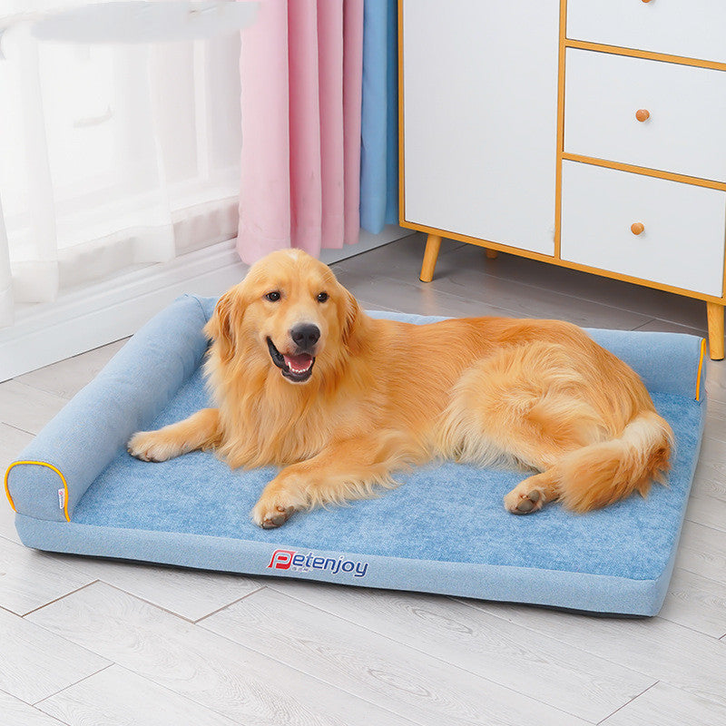 Happy Golden Retriever relaxing on blue washable dog bed with supportive foam cushion