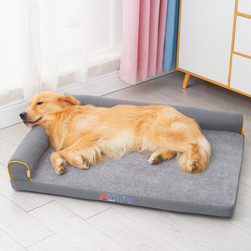 Golden Retriever lying comfortably on grey washable foam dog bed with raised edges