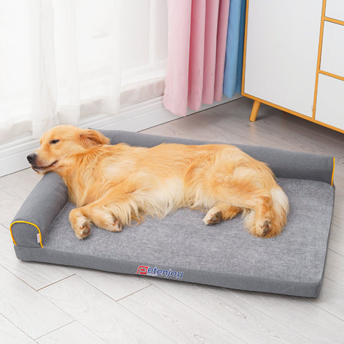 Golden Retriever lying comfortably on grey washable foam dog bed with raised edges