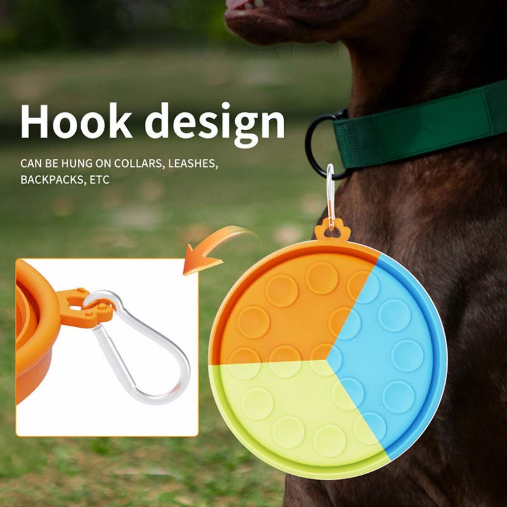 Brighty Fold&Go – Tricolor collapsible dog bowl folded and clipped to a dog collar with carabiner hook