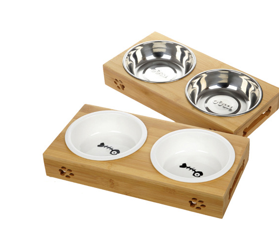 Two bamboo double-bowl stands shown together, one with stainless steel bowls and one with white ceramic bowls.