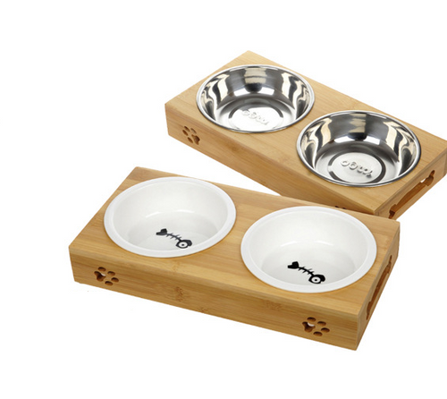Two bamboo double-bowl stands shown together, one with stainless steel bowls and one with white ceramic bowls.