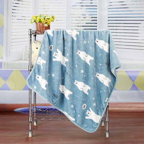 Brighty BearHug soft fleece blanket in blue with polar bear and snowflake print, hanging display