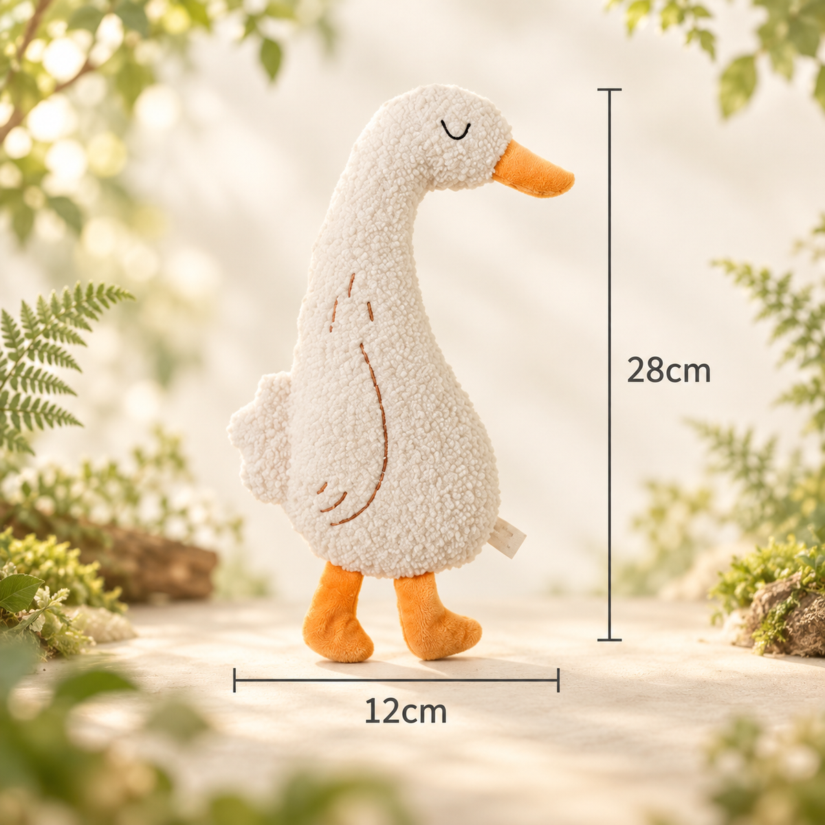 Light-coloured Brighty CuddleKick duck with an orange beak and feet, showing dimensions of 28 cm high by 12 cm wide.