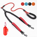 Red and black double dog leash with elastic branches, control loops, matching bag dispenser and four colour swatches.