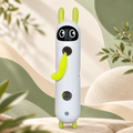 White rabbit-shaped Brighty Peekaboo with green ears and feet, a yellow-green tail and two front openings, displayed against a botanical background.