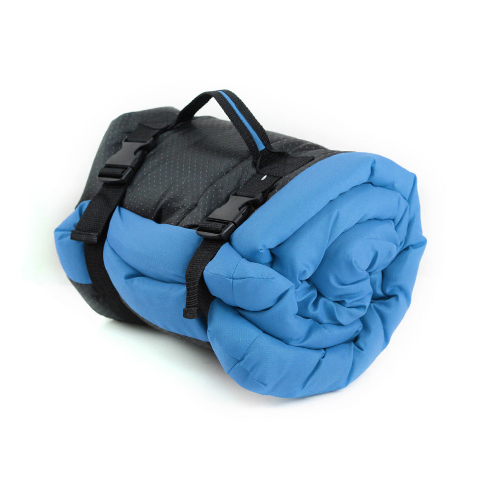 Brighty TravelRest dog travel mat in blue, rolled up and secured with carrying straps