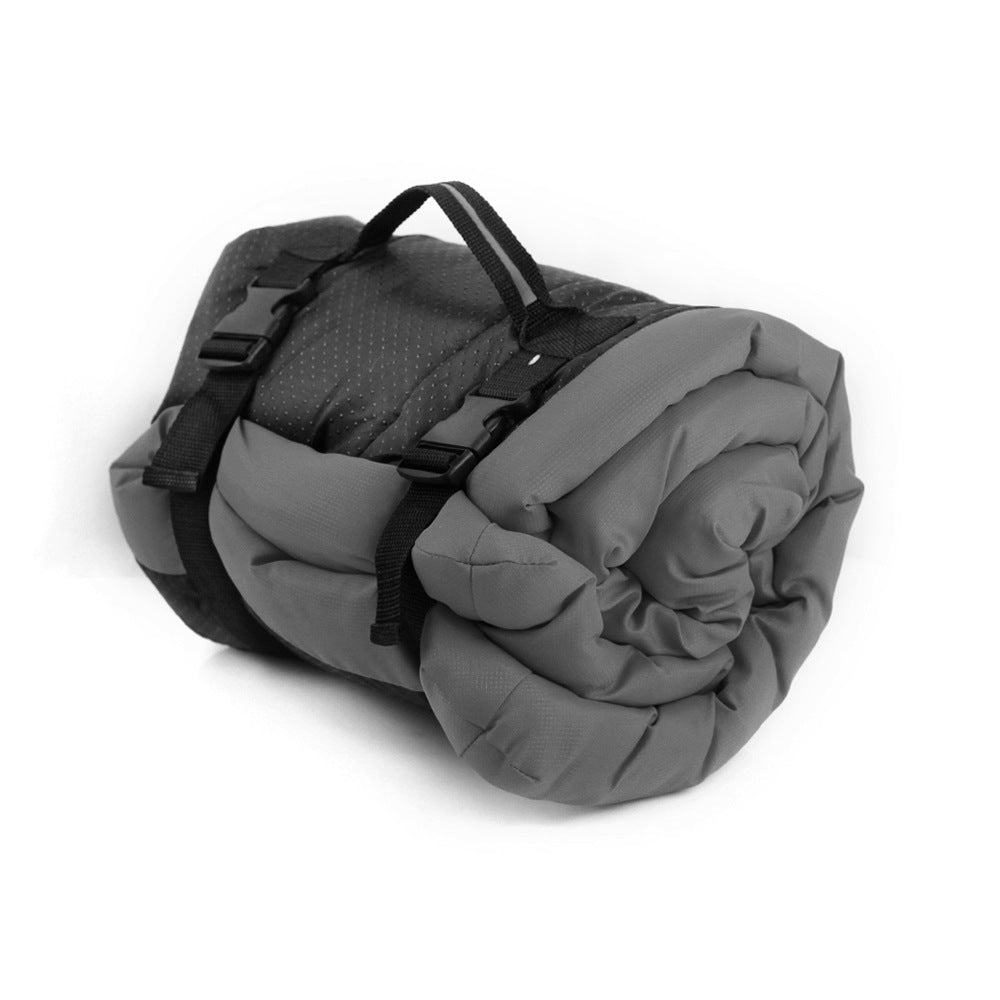Brighty TravelRest dog travel mat in grey, rolled up and secured with carrying straps