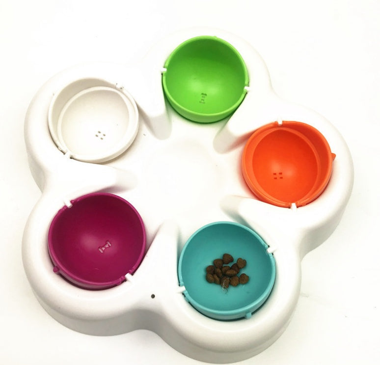 Brighty TreatQuest slow feeder puzzle with lids removed, showing 5 hidden compartments with kibble inside