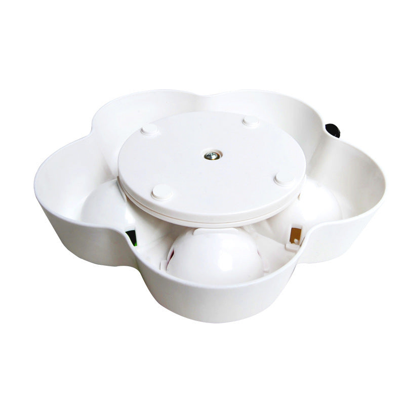 Underside view of the Brighty TreatQuest slow feeder puzzle showing the rotating base mechanism