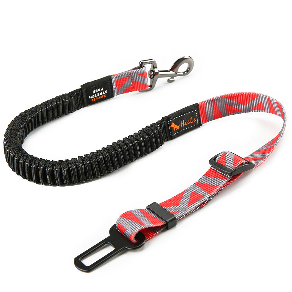Red and grey HEELE RoadFlex dog car tether with an elastic section, swivel clip, adjustable strap and seat belt tab.