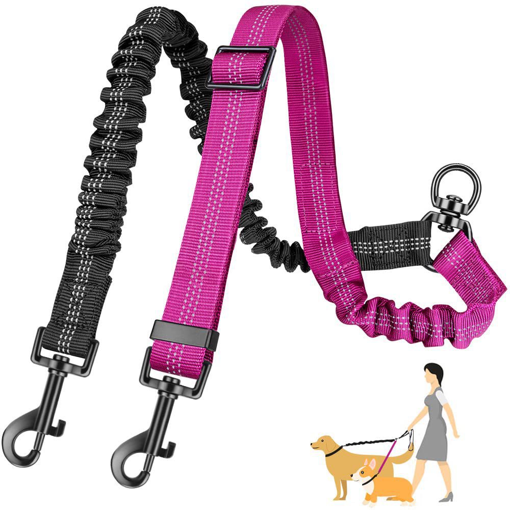 Pink and black elastic double dog leash coupler with adjustable straps, metal clips and a diagram of two dogs being walked.