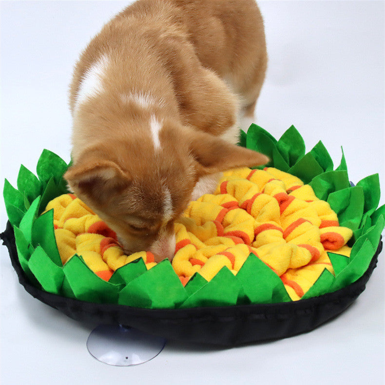 Dog sniffing through the yellow and green Brighty SnuffleFlower foraging mat during enrichment play.
