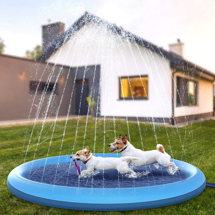 Dog playing in Brighty Splash Mat blue water pad with sprinkler jets in backyard