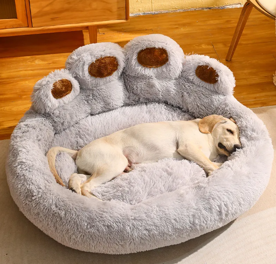 Light grey ultra-soft dog bed with white dog sleeping peacefully in cozy paw cushion